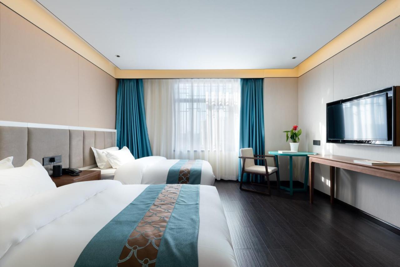 ไชนีส คัลเจอร์ ฮอลิเดย์ โฮเต็ล หนานลัวฉูเซียง Hotel ปักกิ่ง ภายนอก รูปภาพ
